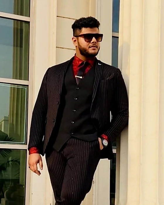 Amritash Chowdhry, founder of Mind Align, in a pinstripe suit
